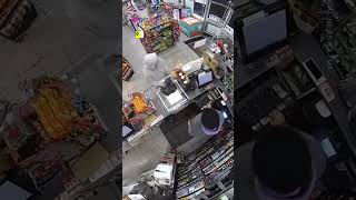 Surveillance Video Captures Police Officer Walking Into A 7Eleven As It Was Being Robbed [upl. by Flossy956]