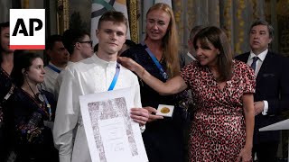 Ukrainian Olympic athletes celebrated at Paris town hall event [upl. by Adnuahsal]