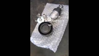 How to replace belt tensioner on Mazda shorts [upl. by Lipscomb]