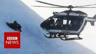 Skiers rescued in dramatic helicopter manoeuvre  BBC News [upl. by Georglana]