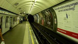 Victoria line train enters Stockwell station [upl. by Enimasaj]