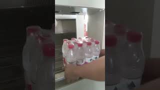 Water bottle packaging shrinking machine packing equipped with laser coding machine [upl. by Zipah]