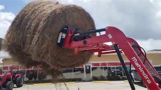 Mahindra 2638 HST lifting a 5 x 6 round bale [upl. by Harhay]