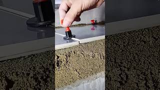 Device for leveling ceramic tiles during installation in action [upl. by Spense]