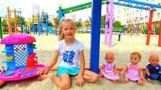 Funny Polina playing with Colored cups and baby dolls on the playground [upl. by Haroppizt]