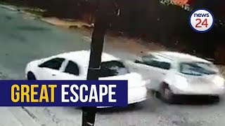 WATCH Motorist escapes hijacking reverses into assailants car [upl. by Antonina]