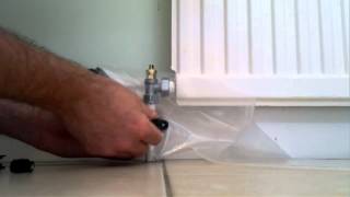 Draining a radiator  Replacing a valve  Its super easy with Rapid RaDrain [upl. by Peedsaj]