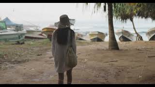 Woman in Sunhat Strolling Towards Boats on Sri Lankan Beach [upl. by Annalla62]