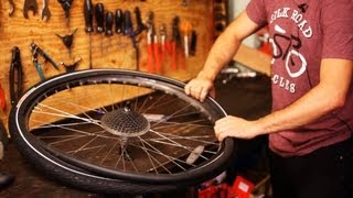 How to Put on New Bike Tire amp Tube  Bicycle Repair [upl. by Aromat]