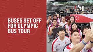 Buses leave OCBC Square for Team Singapore opentop bus parade around Singapore [upl. by Enitram]