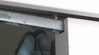 Installing the door on an Eclisse Syntesis Line pocket door system [upl. by Peterson591]