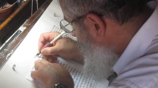 A scribe begins to write a new Torah scroll Genesis The ancient synagogue at Masada Israel [upl. by Lounge97]