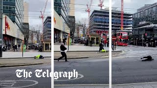 Pedestrians blown over by strong winds as Storm Eunice batters Britain [upl. by Ard]