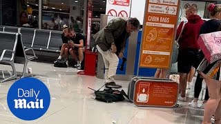 EasyJet passenger destroys his luggage to avoid excess baggage fee [upl. by Cristiona]