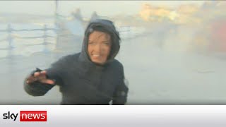 Storm Eunice Sky correspondent gets hit by wave [upl. by Tarrel691]