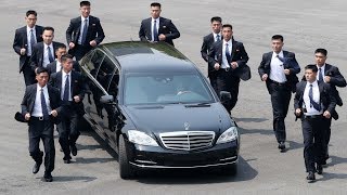 Kim Jonguns bodyguards jog alongside limo [upl. by Akino722]