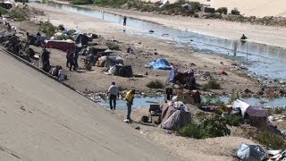 Cientos deportados viven en un desagüe de Tijuana [upl. by Limay536]