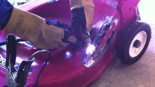 Welding a Lawn Mower Deck with Miller Equipment [upl. by Halford]