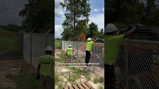 Barbed wire installation on a commercial chainlink fence [upl. by Asiul]