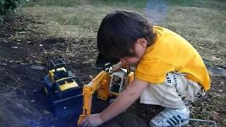 Kid Plays With Toy Excavator In Dirt [upl. by Haag590]