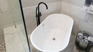 Bathroom remodel with freestanding soaking tub by Construction Specialties [upl. by Bores507]