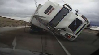 Raw Big Rig Blows Over Crushes Patrol Car [upl. by Hanfurd]