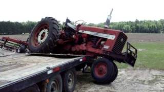 Farmall 656 Gooseneck trailer unloading accident [upl. by Monique]