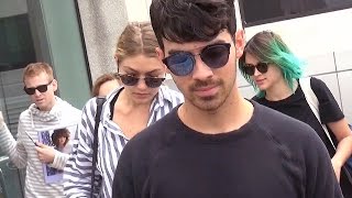 New Couple Gigi Hadid And Joe Jonas Too Exhausted For Tourists At LAX [upl. by Adnilra]