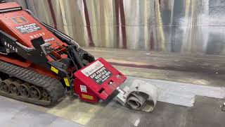 Removing paint on a floor with a Stand on Skidloader Scraper Rent  wwwgappowercom [upl. by Cire]