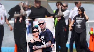 Doting dad Travis Barker cradles baby Rocky as he and wife Kourtney Kardashian arrive in Sydney [upl. by Nannette801]