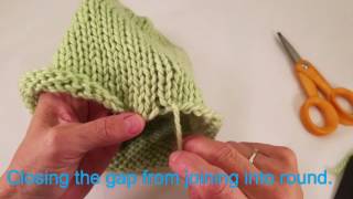 Closing the gap from joining knitting into the round [upl. by Ennairod]