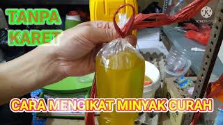 cara mengikat minyak curah menggunakan tali rafia tanpa karet minyak minyakgoreng binding oil [upl. by Alegna249]