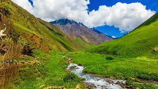 gorgeous mountain gorge with green slopes at sunny summer day in Kyrgyzstan [upl. by Lyrret]