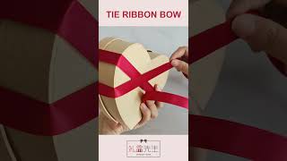 How to tie a ribbon on a heart shaped gift box shorts giftwrappingideas ribbonbow [upl. by Okomot]