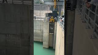 Insertion of filler beam in spillway guide damexploration nature travel waterdam [upl. by Ynahirb]