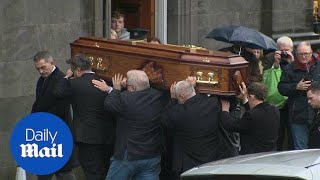 Coffin of Dolores ORiordan is being carried into church  Daily Mail [upl. by Harwin]