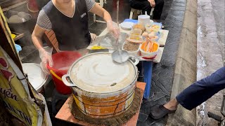 Banh cuon shop on the sidewalk in Vietnam look how she makes it What do you do [upl. by Enylhsa709]