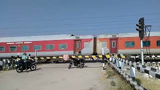 The Red Train thrashes a Level crossingIndian Railways YPR GKP Exp [upl. by Leonelle]