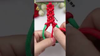 Instructions for tying a super beautiful red flower bracelet diycraft diy craft [upl. by Aronaele336]