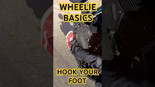 Learning how to wheelie Learn to hook your foot under your left peg It will keep you locked in [upl. by Ennybor]