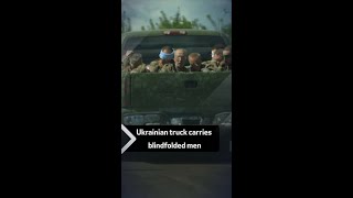 Ukrainian truck carries blindfolded men [upl. by Ettennig]