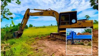 Excavator CAT Caterpillar E120B Working To The Trucks [upl. by Olbap]