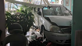 Car crashes through hair salon misses employee by inches [upl. by Hatfield396]