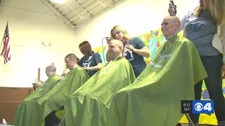 Men woman and children get their heads shaved to fight cancer [upl. by Mikel]