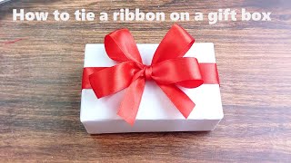 How to tie a ribbon on a gift box [upl. by Ostler]