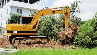 Tree removing heavy equipment excavator caterpillar E120B best skill [upl. by Etnom628]