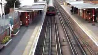 Central line train leaving Theydon Bois tube station [upl. by Pammy]