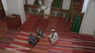 Güzelyurt Turkey Conversation with an Imam  Rick Steves’ Europe Travel Guide  Travel Bite [upl. by Ateuqram]