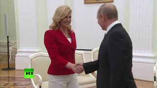 Russia Croatian president gives Putin personalised national team jersey [upl. by Kcuhc]