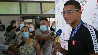 Tunisias new Olympic king Ahmed Hafnaoui arrives in Tunis  AFP [upl. by Almund]